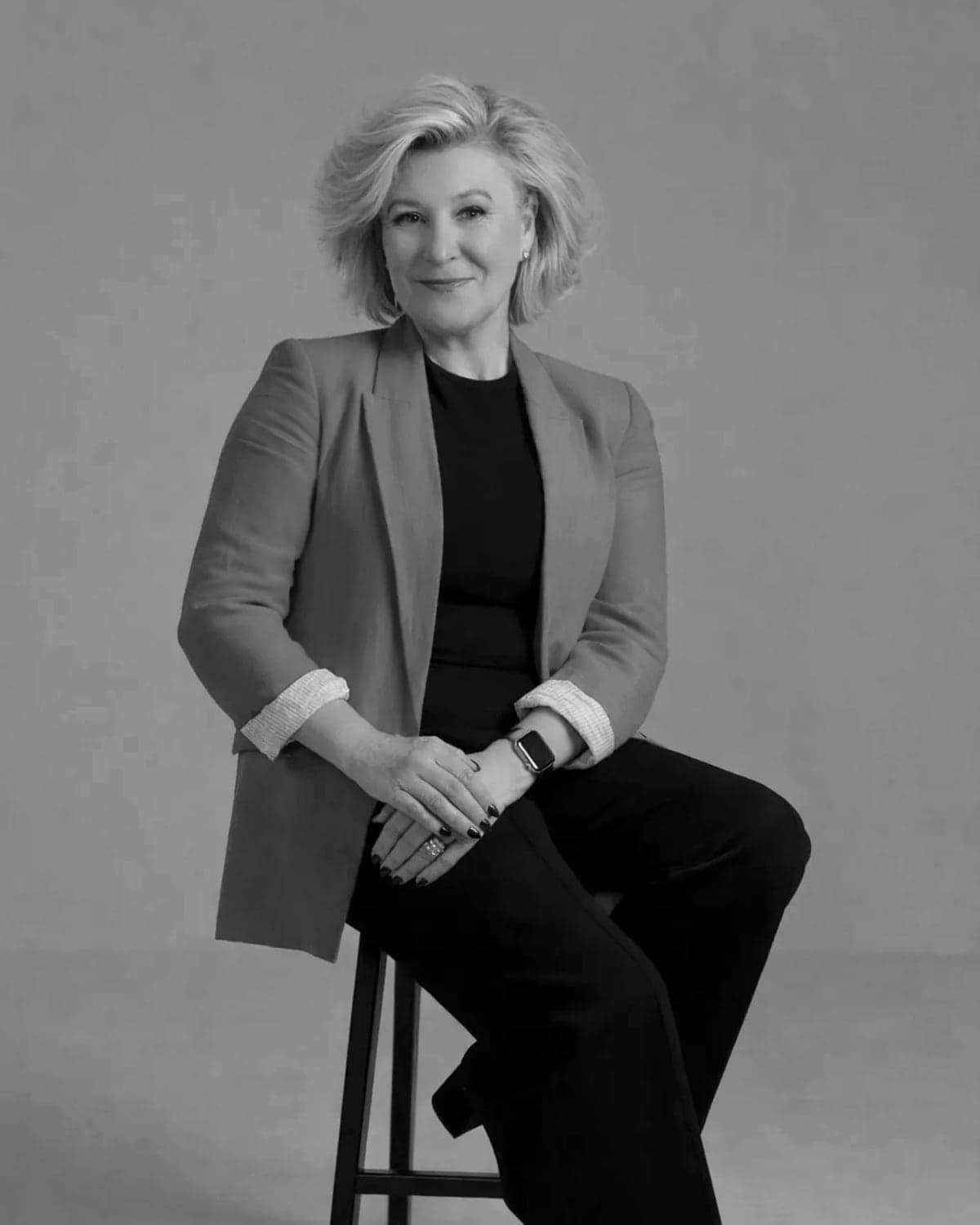 Jac Phillips, co-founder of FFi, seated on a stool and smiling
